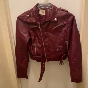 The woman’s leather jacket